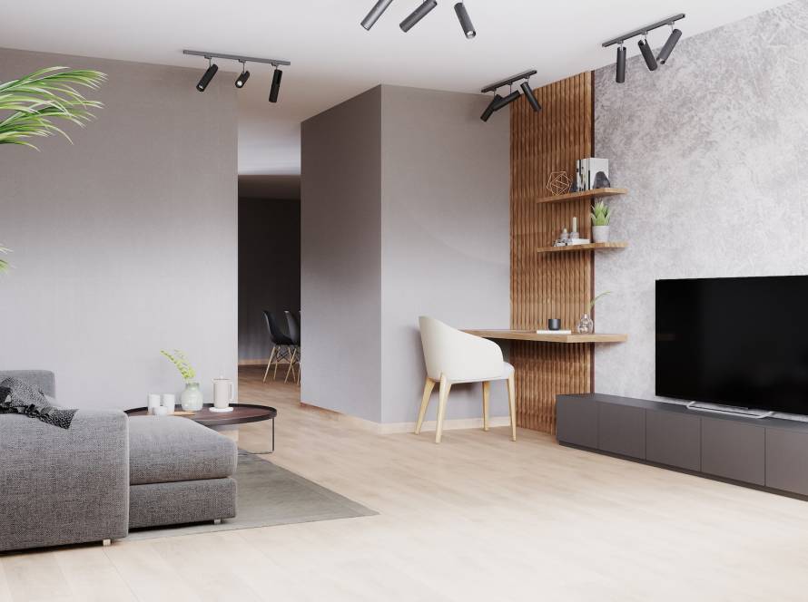 Bright modern living room with gray sofa, white chair on wooden laminate